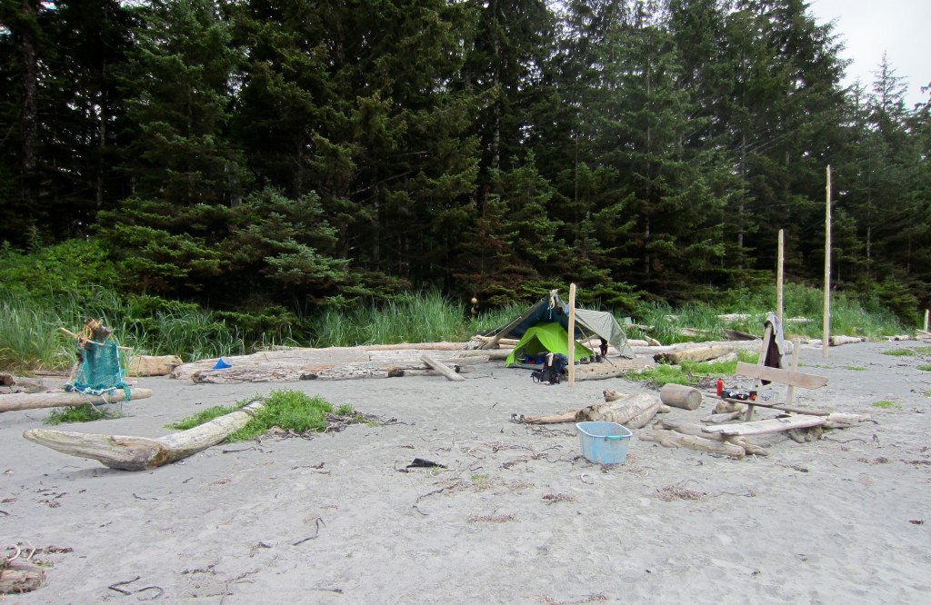 Tent under tarp left by previous campers